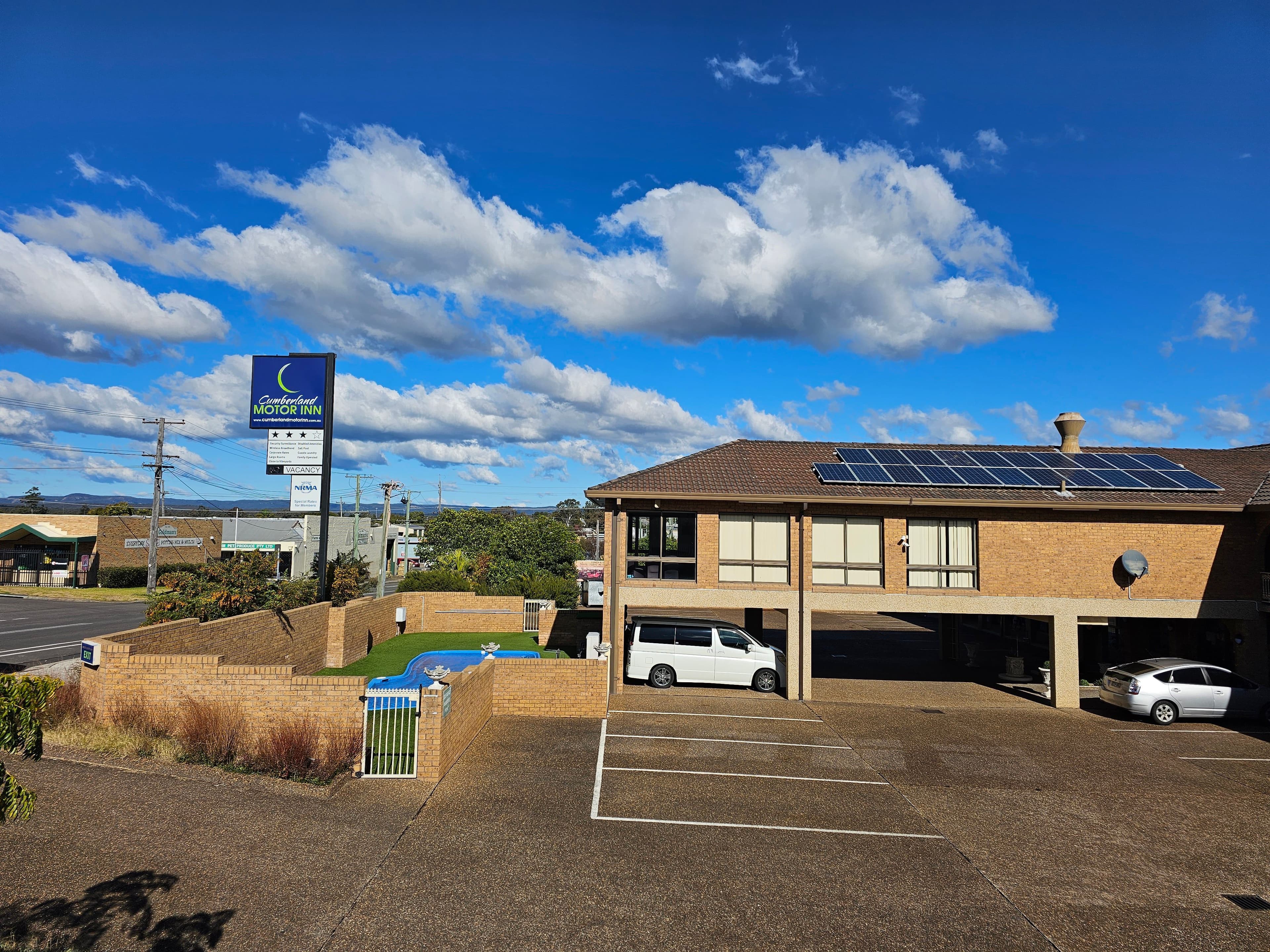 Elevated view of Cumberland Motor Inn reception building and outdoor salt-water pool